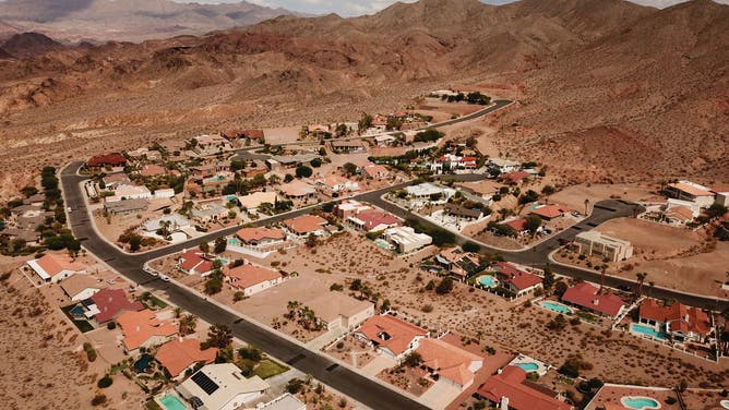 An aerial image shows homes and backyard swimming pools during low water levels due to the western drought on July 20, 2021 in Boulder City, Nevada.