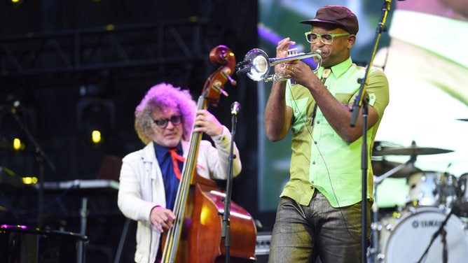 Trumpet player Branden Lewis performs.