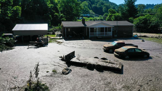 inches of mud in front yard of home