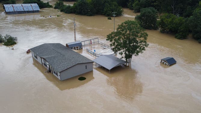 Homes submerged under flood waters from the North Fork of the Kentucky River are seen from a drone in Jackson, Kentucky, on July 28, 2022. -