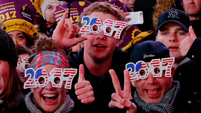 People ring in 2017 with New Years Eve glasses.