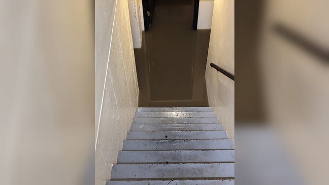 A flooded stairwell and basement from rainfall in Missouri.