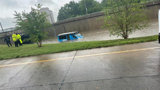 A metro bus in St. Louis covered in floodwaters after historic rainfall on July 26, 2022