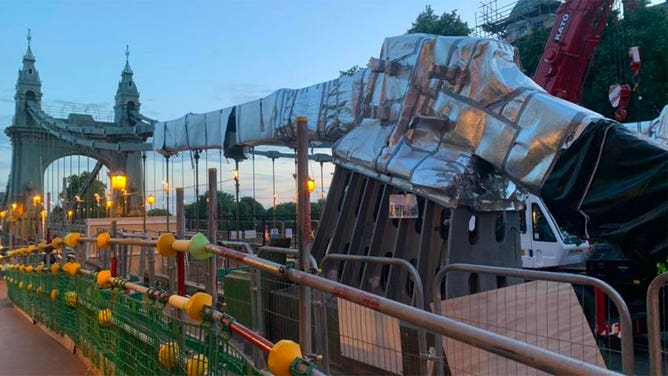 Hammersmith Bridge is seen wrapped in foil in July 2022