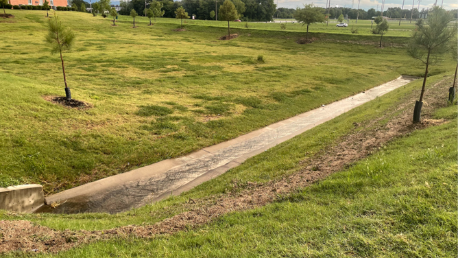 A child playing near a retention pond in Arkansas during heavy rainfall on Monday was killed after falling into the water and being pulled into a storm drain, according to local officials.
