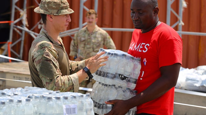 Members of the Humanitarian and Disaster Relief (HADR) team from the RFA Mounts Bay of the UK's Royal Navy provide aid assistance to the Islanders of Great Abaco on September 4, 2019 in Great Abaco, Bahamas.