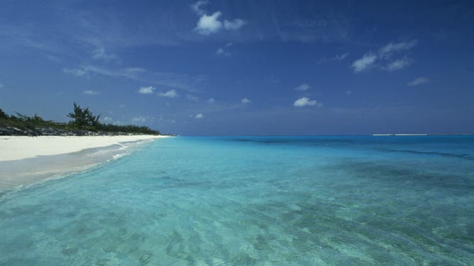 Crystal clear sea and the beach along the coast north of George Town, Great Exuma, Bahamas.