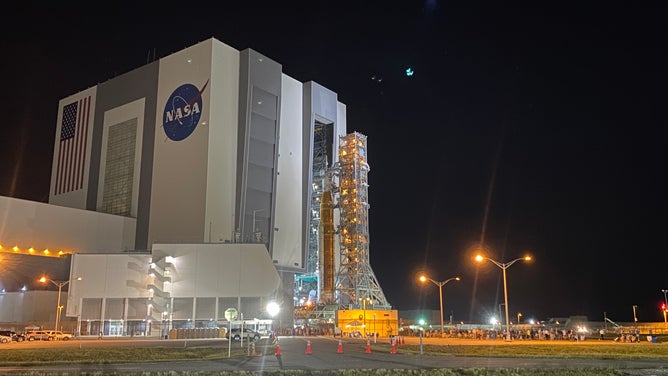 NASA's SLS rocket and Orion spacecraft leave the Kennedy Space Center Vehicle Assembly Building on Aug. 16, 2022. The Artemis-1 rocket was moved to launchpad 39B ahead of the late August launch to the moon.