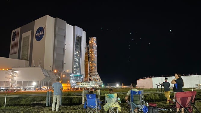 NASA's SLS rocket and Orion spacecraft leave the Kennedy Space Center Vehicle Assembly Building on Aug. 16, 2022. The Artemis-1 rocket was moved to launchpad 39B ahead of the late August launch to the moon.