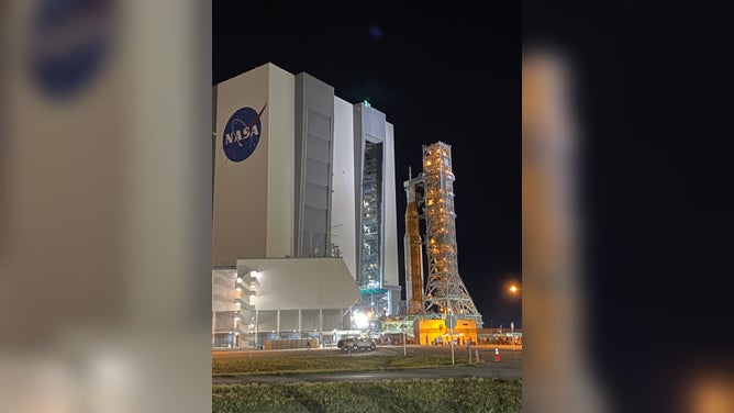 NASA's SLS rocket and Orion spacecraft leave the Kennedy Space Center Vehicle Assembly Building on Aug. 16, 2022. The Artemis-1 rocket was moved to launchpad 39B ahead of the late August launch to the moon.
