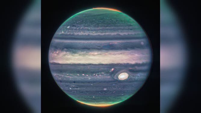 Webb NIRCam composite image of Jupiter from three filters – F360M (red), F212N (yellow-green), and F150W2 (cyan) – and alignment due to the planet’s rotation.