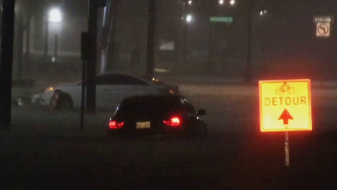 A car is seen stranded in floodwaters in the Dallas-Fort Worth area.