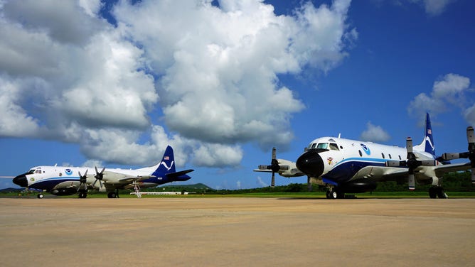 NOAA's "Kermit" and "Miss Piggy" aircraft on the tarmac.