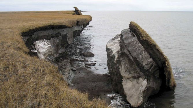 Thawing permafrost can result in the loss of terrain, as seen in this image where part of the coastal bluff along Drew Point, Alaska, has collapsed into the ocean.