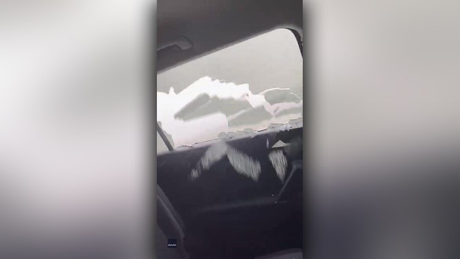 Alberta hail storm damages car