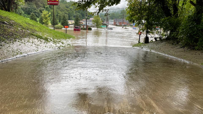 Flooding caused by heavy rainfall covers roads and vehicles in Kanawha County, West Virginia on Aug. 15, 2022.