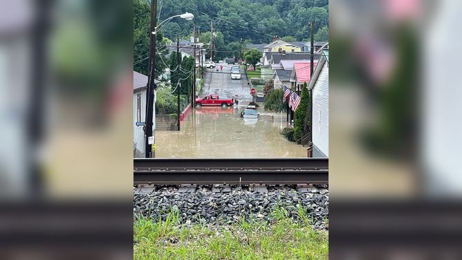 Flooding caused by heavy rainfall covers roads and vehicles in Kanawha County, West Virginia on Aug. 15, 2022.