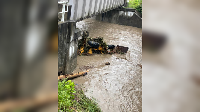 Flooding caused by heavy rainfall covers roads and vehicles in Kanawha County, West Virginia on Aug. 15, 2022.