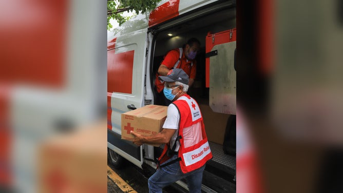 September 19, 2022. Salinas, Puerto Rico. Red Cross volunteer Benjamín Rodríguez unloads from the Red Cross Emergency Response Vehicle boxes of comfort kits for shelter residents in the Carlos Colón Burgos School in Salinas.