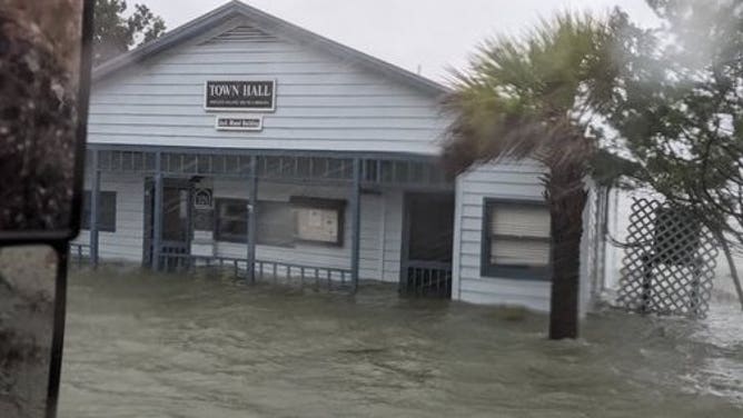 Residents & pets at a residence on 300 block of Myrtle Ave needed to be rescued by Midway FD via their high water vehicle. Everyone is ok but a scary situation. Pawleys Island, South Carolina.