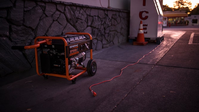 An electrical plug lies on the ground next to a generator at a Union 76 gas station during a blackout in Calistoga, California, U.S., on Thursday, Oct. 24, 2019.