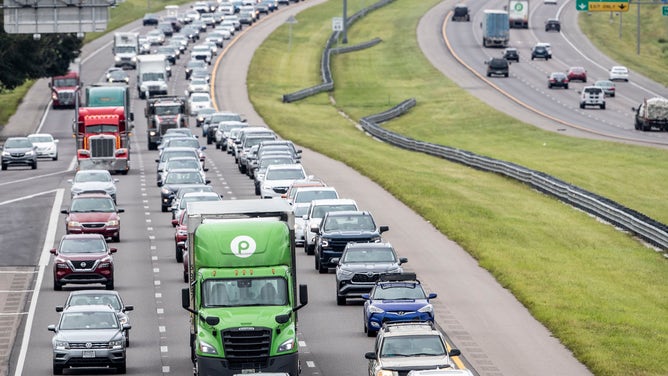 Tampa Bay area residents and drivers fill the lanes on I-4 as they escape the high winds and flood waters of Hurricane Ian with just a day left before the storm lands in Tampa, Florida, Tuesday, Sept. 27, 2022.