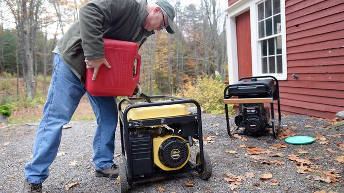 John Avery of Standish fills his generator with gas Thursday, November 2, 2017.