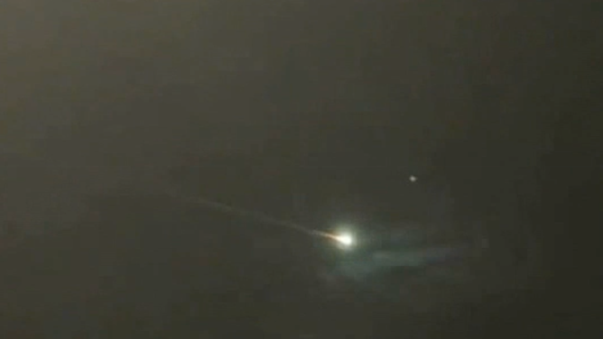 A possible meteor or space debris creates a fireball in the sky above Paisley, Scotland on Wednesday, Sept. 14, 2022.