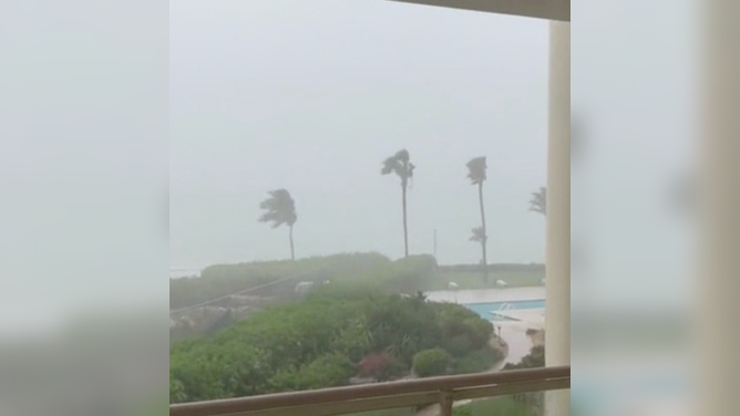 Video from the island Providenciales showed the outer bands of Fiona's hurricane-force winds lashing the shores of the island.