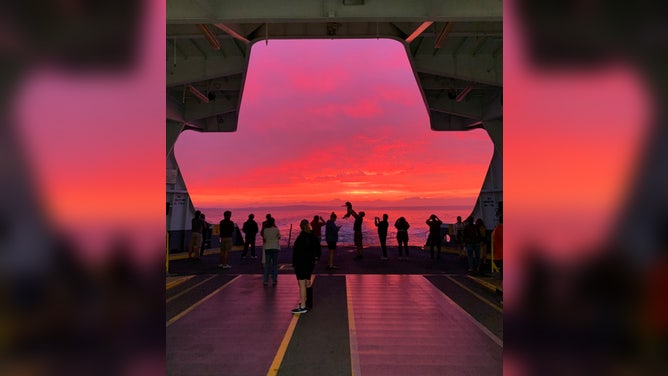 The sunset, rain and smoke from wildfires in the Pacific Northwest created a colorful sunset in Seattle on Sunday, Sept. 11, 2022. 