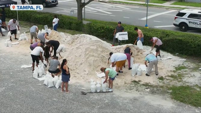 Tampa residents begin filling sandbags in advance of Tropical Storm Ian.