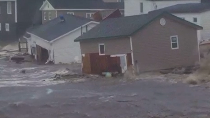 Storm surge swamping homes