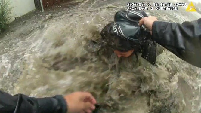 Officer rescues woman from flood
