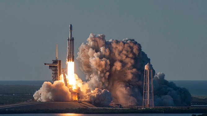 A SpaceX Falcon Heavy blasts off from Kennedy Space Center with the Arabsat-6A satellite in April 2019.