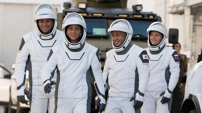 NASA astronauts Josh Cassada from left and Nicole Mann, second from left, Japan Aeronautics and Space Exploration Agency (JAXA) astronaut Koichi Wakata, second from right, and Roscosmos cosmonaut Anna Kikina, right, dressed in a SpaceX spacesuit, preparing to leave the plane.  Neil A. Armstrong Operations and Control Building for Launch Complex 39A, Sunday, October, during a dress rehearsal prior to the launch of the Crew-5 mission.  2, 2022 at NASA's Kennedy Space Center in Florida.