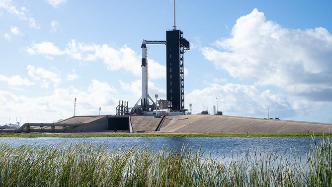 A SpaceX Falcon 9 rocket with the company's Crew Dragon spacecraft onboard is seen on the launch pad at Launch Complex 39A as preparations continue for the Crew-5 mission, Tuesday, Oct. 4, 2022, at NASA’s Kennedy Space Center in Florida. NASA’s SpaceX Crew-5 mission is the fifth crew rotation mission of the SpaceX Crew Dragon spacecraft and Falcon 9 rocket to the International Space Station as part of the agency’s Commercial Crew Program. NASA astronauts Nicole Mann and Josh Cassada, Japan Aerospace Exploration Agency (JAXA) astronaut Koichi Wakata, and Roscosmos cosmonaut Anna Kikina are scheduled to launch at 12:00 p.m. EDT on Oct. 5 from Launch Complex 39A at the Kennedy Space Center.