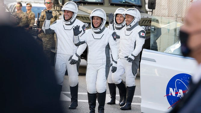 NASA astronaut Josh Cassada, left, NASA astronaut Nicole Mann, second from right, Roscosmos cosmonaut Anna Kikina, second from right, and Japan Aerospace Exploration Agency (JAXA) astronaut Koichi Wakata right, wearing SpaceX spacesuits, are seen as they prepare to depart the Neil A. Armstrong Operations and Checkout Building for Launch Complex 39A to board the SpaceX Crew Dragon spacecraft for the Crew-5 mission launch, Wednesday, Oct. 5, 2022, at NASA’s Kennedy Space Center in Florida.