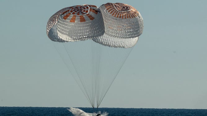 The SpaceX Crew Dragon Freedom spacecraft is seen as it lands with NASA astronauts Kjell Lindgren, Robert Hines, Jessica Watkins, and ESA (European Space Agency) astronaut Samantha Cristoforetti aboard in the Atlantic Ocean off the coast of Jacksonville, Florida, Friday, Oct. 14, 2022. Lindgren, Hines, Watkins, and Cristoforetti are returning after 170 days in space as part of Expeditions 67 and 68 aboard the International Space Station.