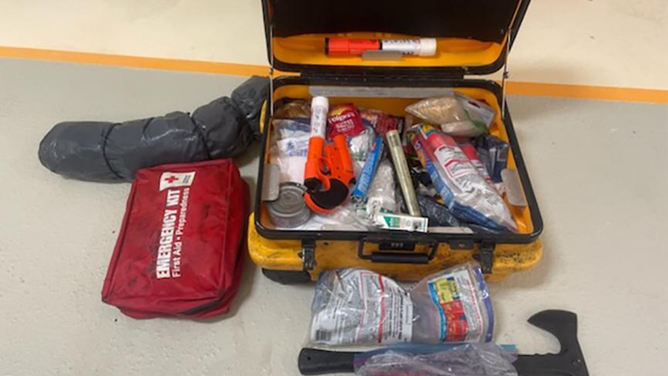 Photo shows an emergency kit that was utilized by a man whose fishing vessel sank in Freshwater Bay, Alaska, Oct. 19, 2022. It's important that mariner's stock their emergency kits with non-expired items including a flashlight and extra batteries, fire extinguisher, radio device, flares, extra rope, water and non-perishable foods.