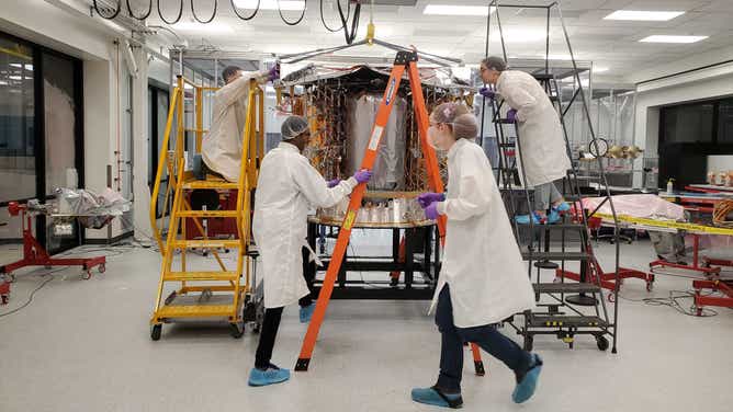 Astrobotic engineers work on the Peregrine lunar lander at the company's headquarters in Pittsburgh, which is also home to the Moonshot Museum where visitors can see views into the cleanroom.