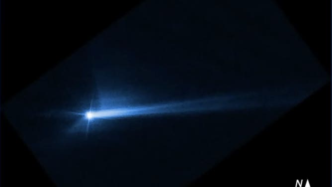 A Hubble Space Telescope image taken on Oct. 8, 2022 shows a new debris trail from Didymos and Dimorphos, the asteroid NASA rammed a spacecraft into.