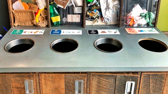 Recycling sorting bins at healthy take out restaurant, Boston, Massachusetts.