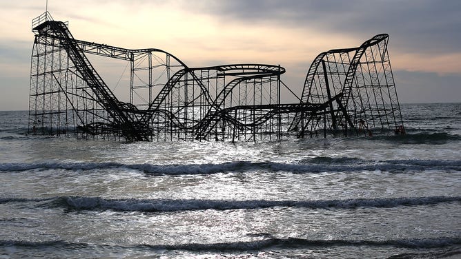 The Star Jet roller coaster remains in the water after the Casino Pier it sat on collapsed from the forces of Superstorm Sandy.