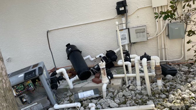 The storm surge pushed over pool motors that broke a propane pipe, which cause propane to leak.