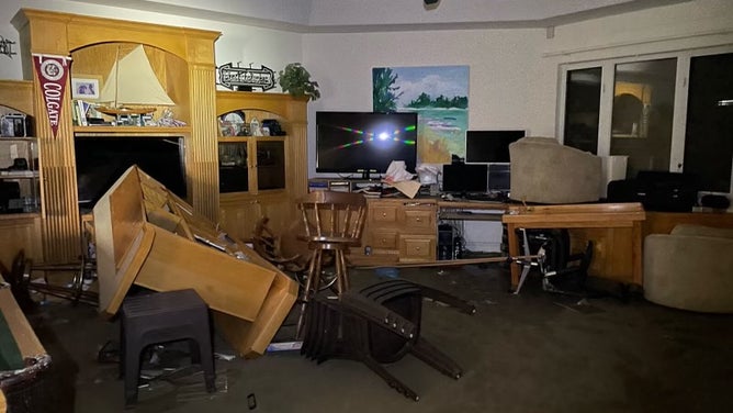 Furniture piled in disarray.