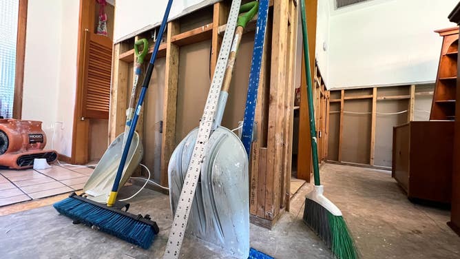 Shovels, brooms and other cleaning tools in Naples, Florida.