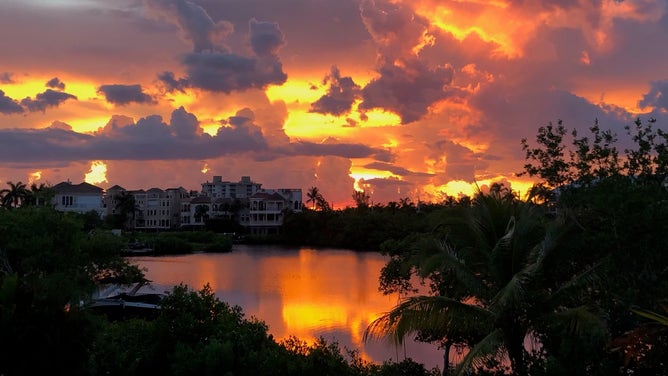 In this view from the Andrews home, the sunset sets the sky on fire.