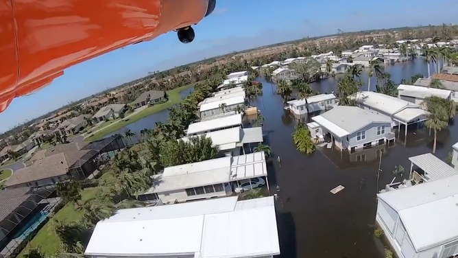 The view from a U.S. Coast Guard helicopter over a flooded Sanibel Island community after Hurricane Ian.