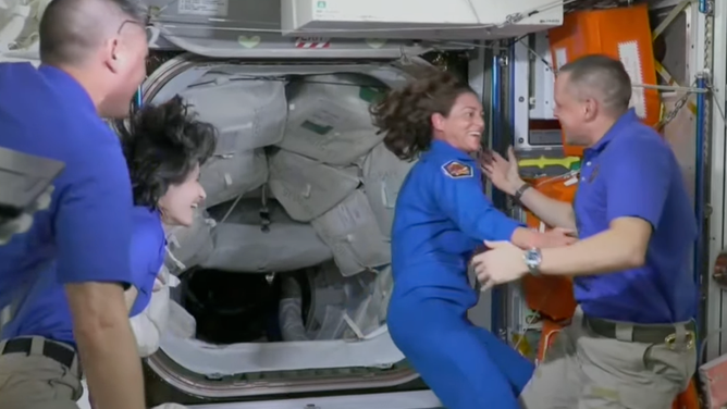 Astronaut and Crew-5 commander Nicole Mann greets astronaut Bob Hines on the International Space Station on Oct. 6, 2022. 