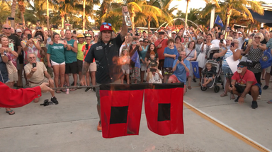 Florida residents celebrate ending of hurricane season by burning flags
